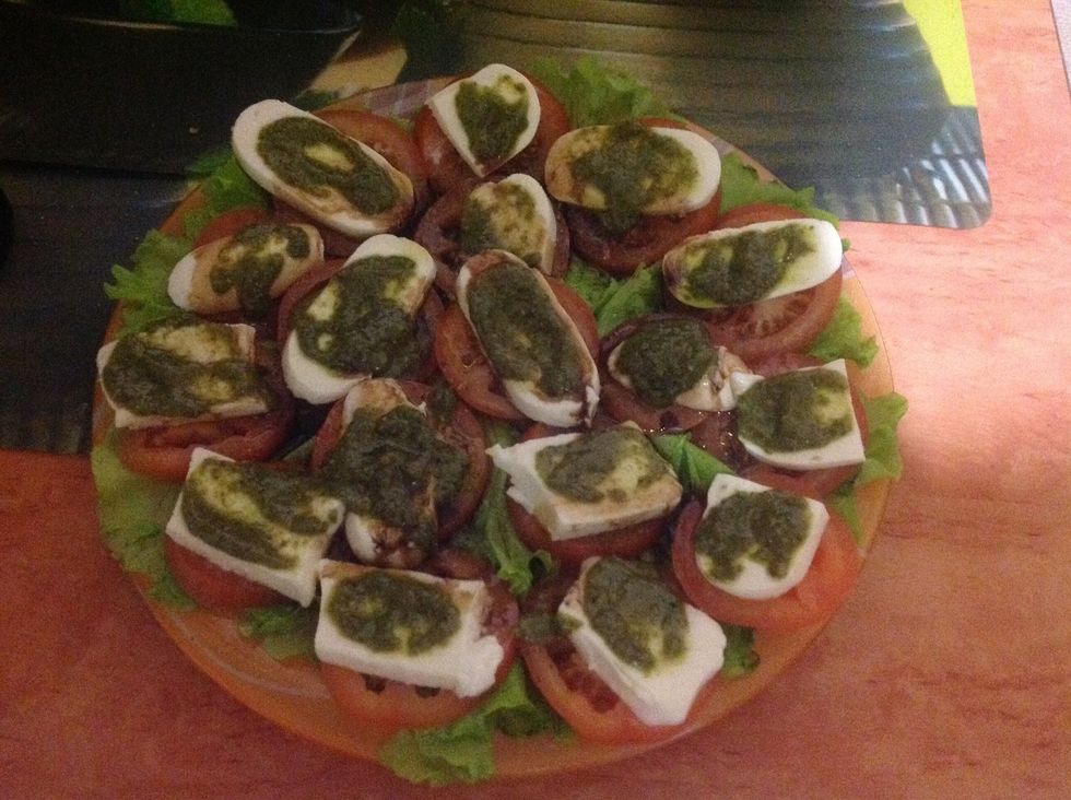 Cover mozzarella with pesto