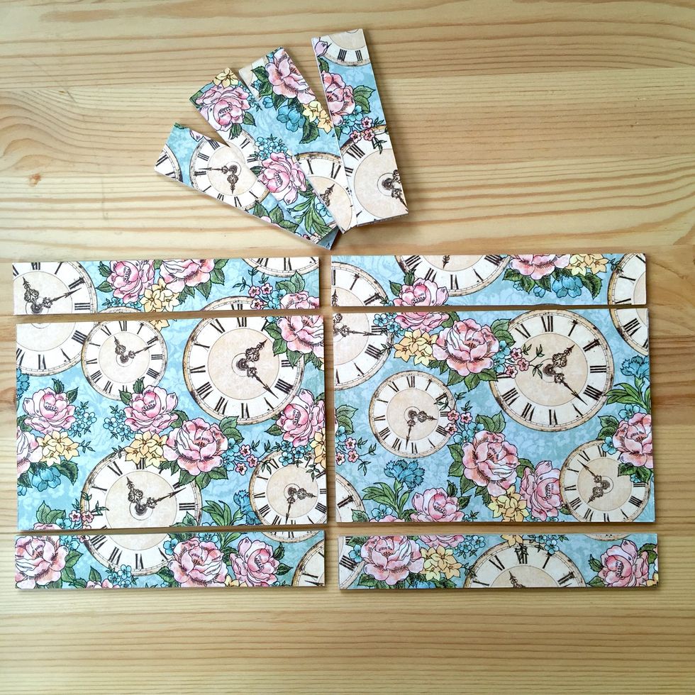 Cover one side of the pieces with decorated paper.