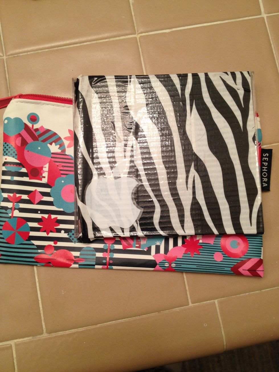 Cover outside of CD case in cute duct tape and add stickers.