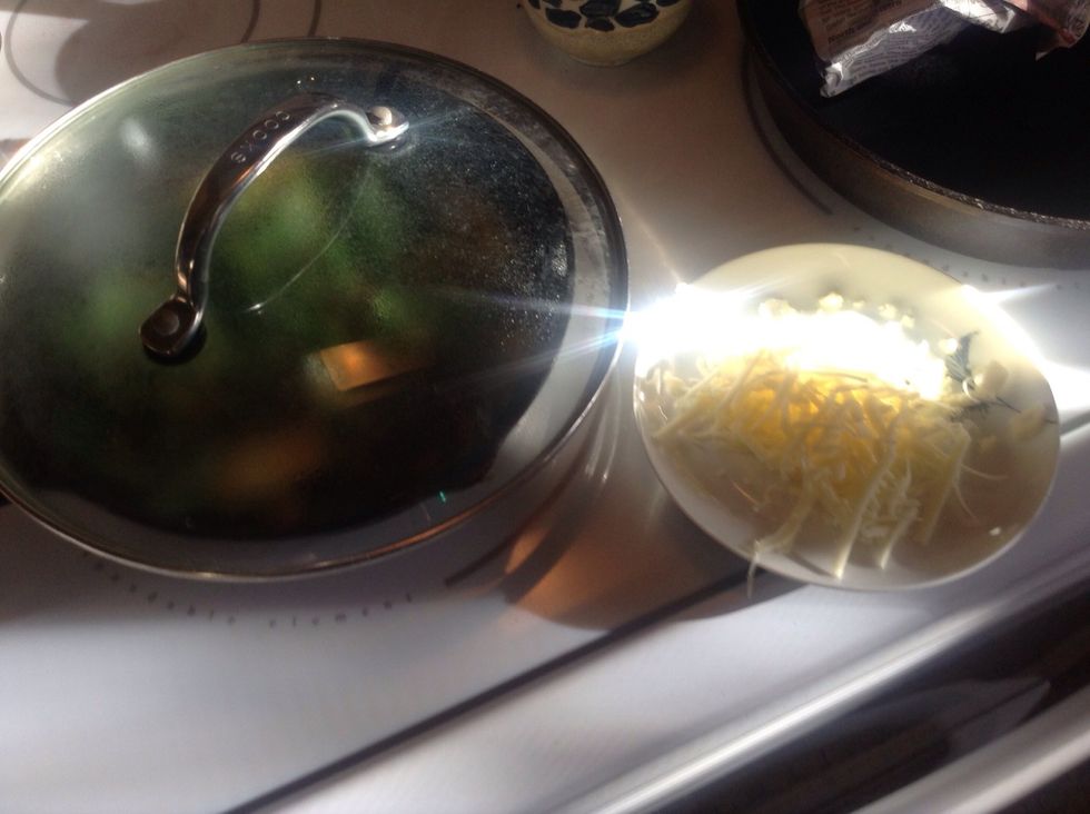 Cover pan to allow chard to steam. Shred 1/2 cup cheese.