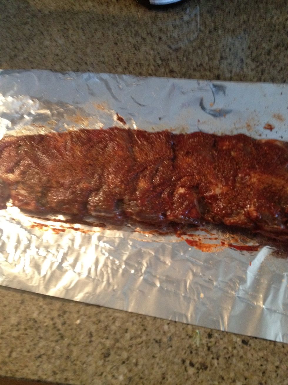 Cover rib with  aluminum foil. Prepare over for 450 degrees Fahrenheit. Cook for 45 minutes.