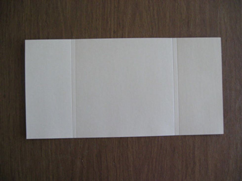 Cover- Score the piece of 6 inch by 12 inch at 2-3/4 inches and 3 inches on one end.  Flip paper over and score it on the other side  at 2-3/4 inches and 3 inches.