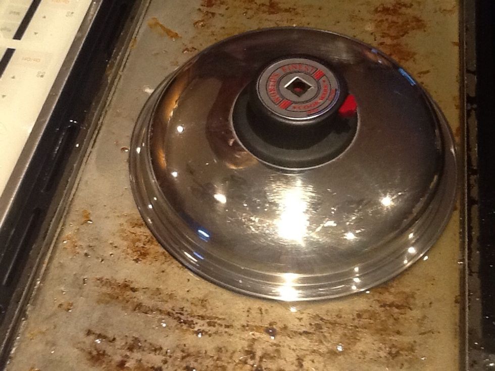 Cover so top of egg cooks from steam before bottom burns.