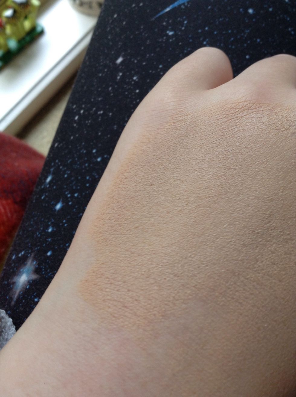 Cover the area you want the bruise to be on with a light coat of foundation