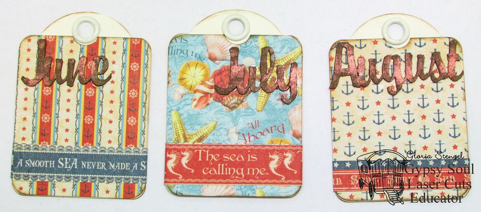 Cover the ATC tags with paper and glue one month word to each tag.