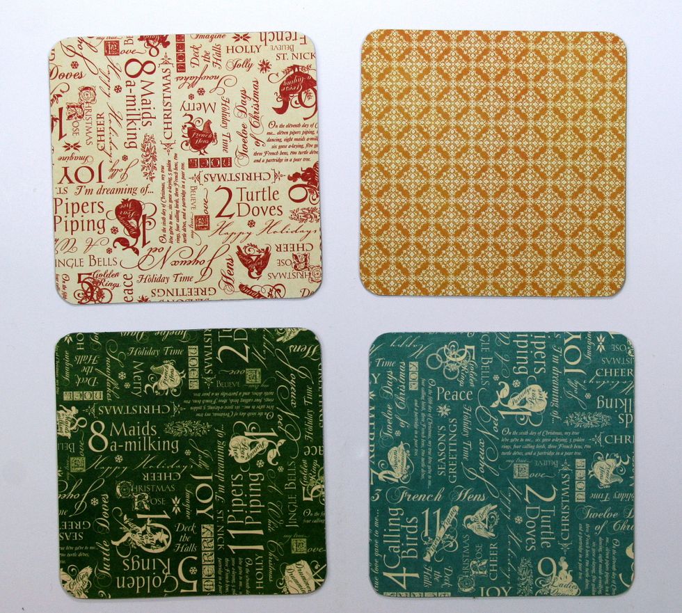 Cover the backs with patterned papers from The Twelve Days of Christmas. Take the time to coordinate with what you'll add to the front.