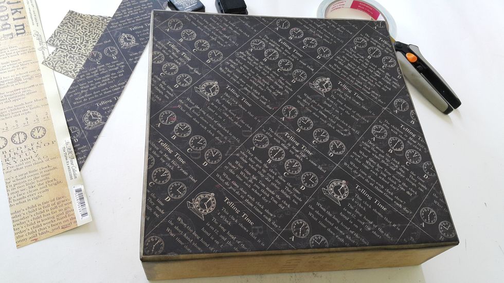Cover the base of the box with paper of 9 \u00bd\u201d x 9 \u00bd\u201d, color with Distress Ink if desired.