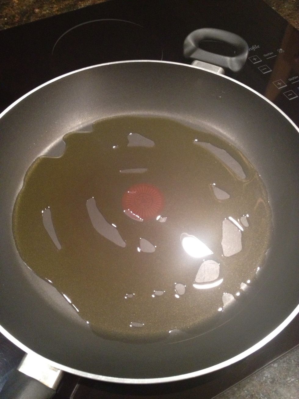Cover the bottom of a frying pan with olive oil, 2-3 Tablespoons is usually enough to cover any pan.
