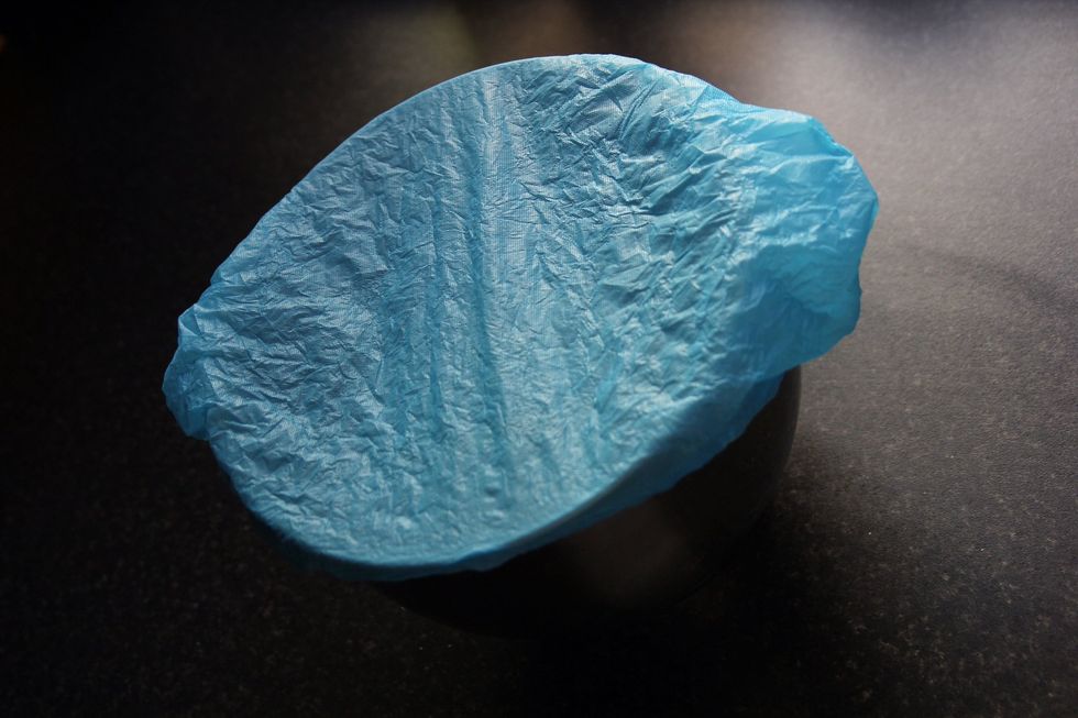 Cover the bowl with cling film (or in my case a shoe cover from the gym!) and leave to prove until at least doubled in size, probably around an hour.