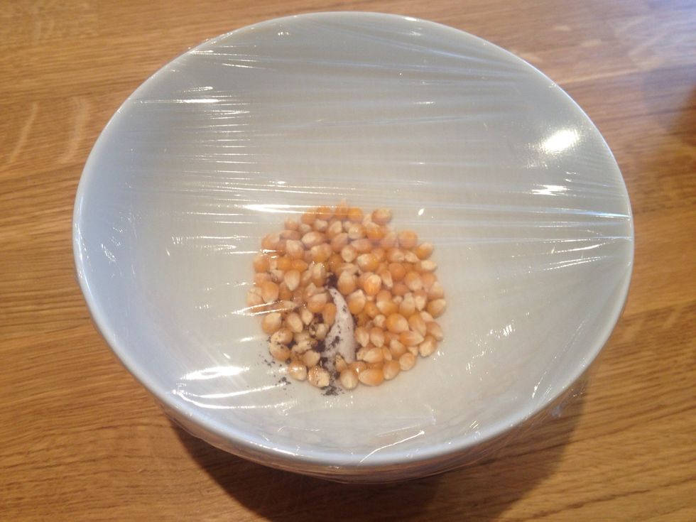 Cover the bowl with cling film or the pan with the lid and heat on a high heat. You'll start to hear the corns popping. Once the popping slows down. Take the bowl/pan off the heat