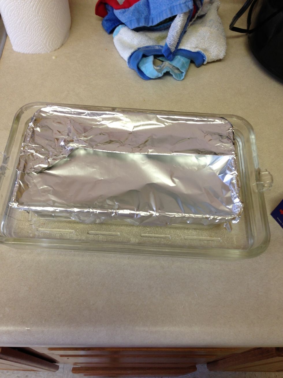 Cover the bread pan with foil so ur flan won't get dry. Bake @ 350 for 2 hours check after and if the flan flees like jello firm then it's ready and take out