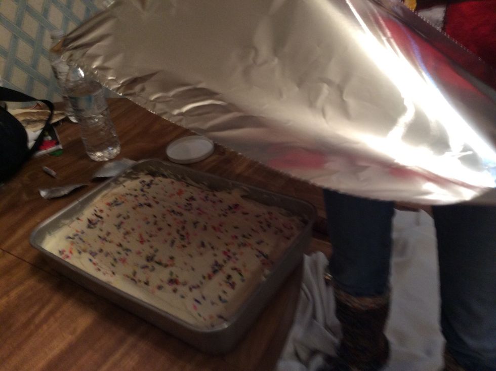 Cover the cake with tin foil first measure out some tin foil the eages should be about 2-3 inches long so you can fold the corners