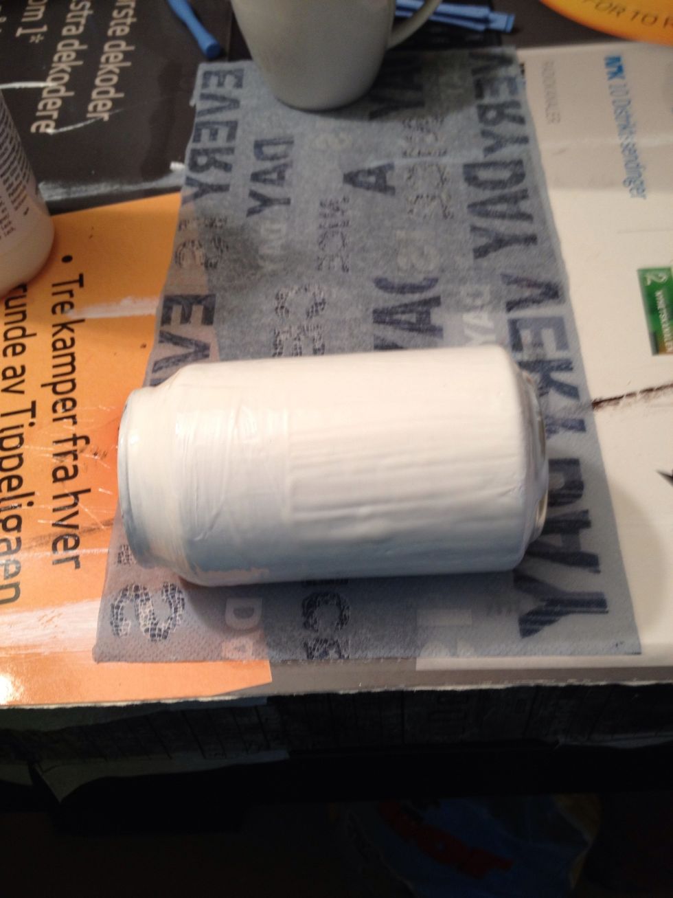 Cover the can with the napkin while the glue is still wet.