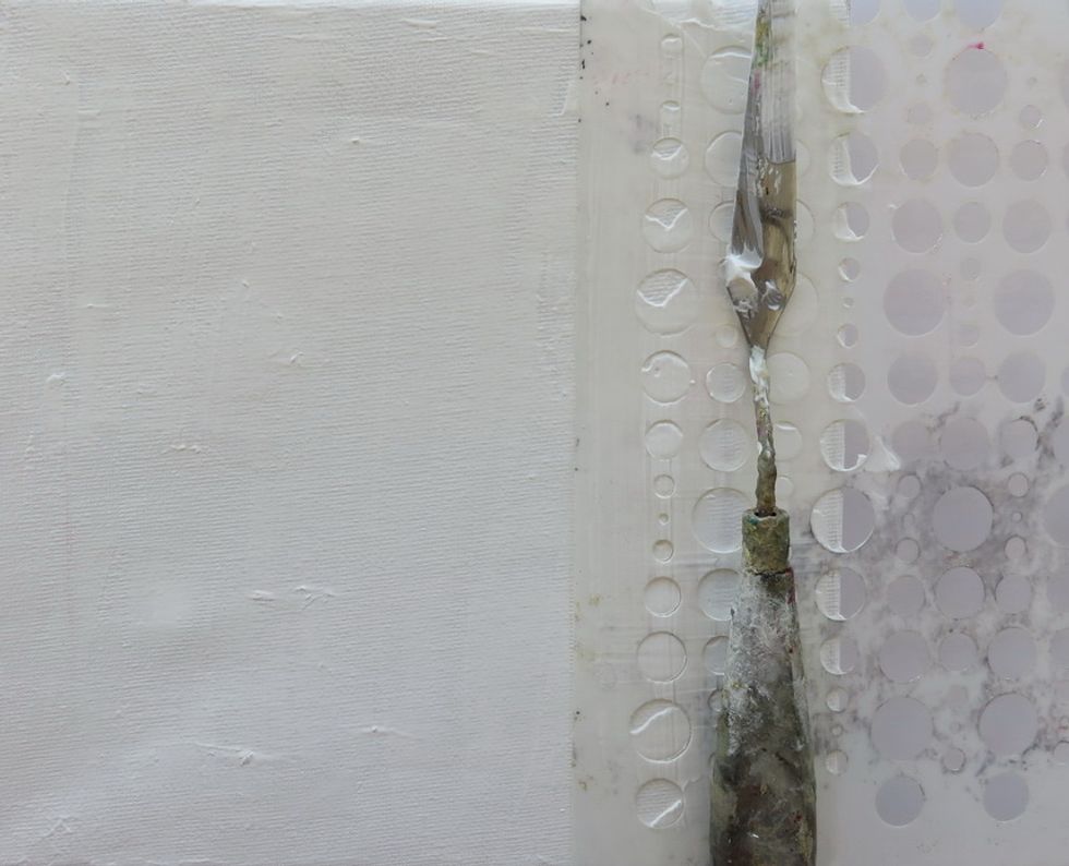 Cover the canvas with a thin layer of white gesso and let it dry. Add random circles using Art Anthology Bubbles stencil and texture paste. Let it dry.