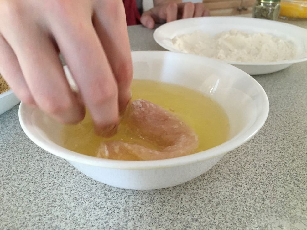 Cover the chicken in egg white