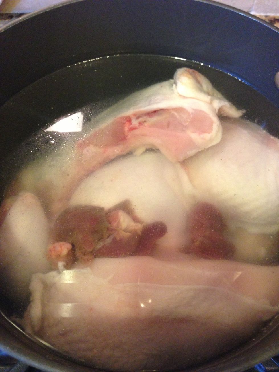 Cover the chicken parts with water.