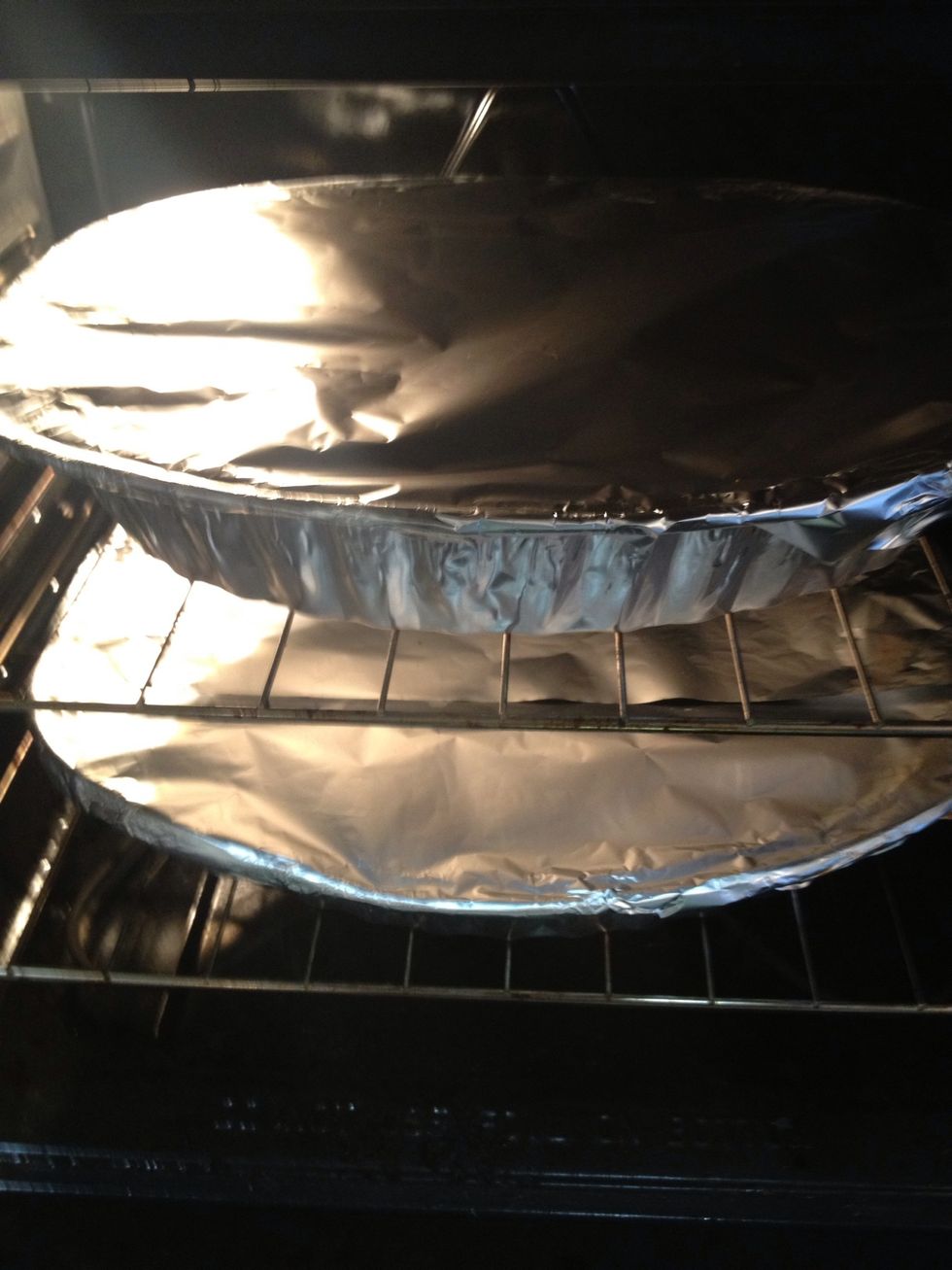 Cover the chicken with Tin foil & place it in the oven for 20 minutes on 350\u00b0.