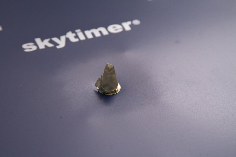 Cover the clock assembly with tape to protect it from paint.