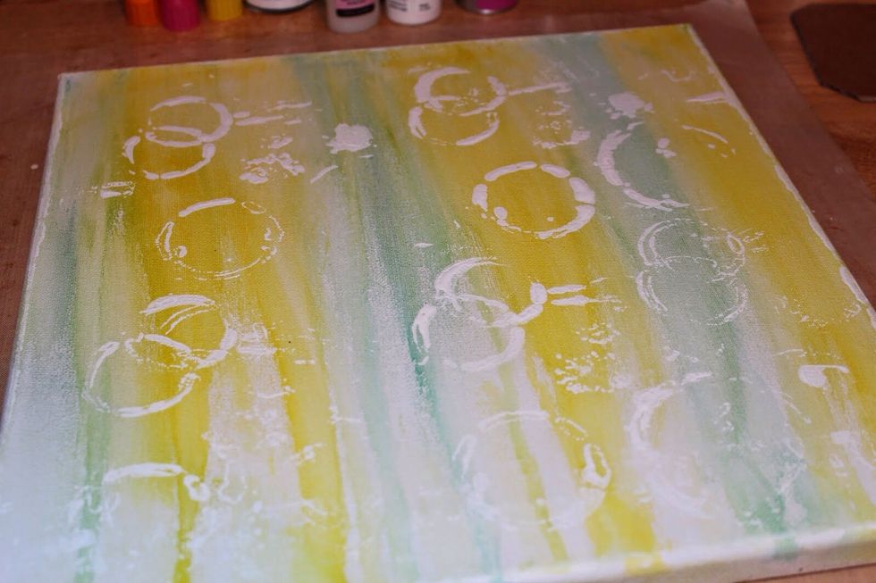 Cover the complete canvas with the stenciled design. Set aside to dry.