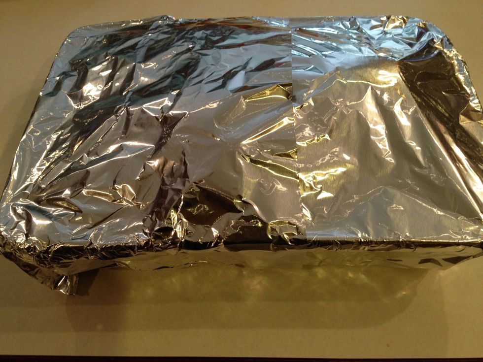 Cover the dish of turkey wings with aluminum foil and bake in the oven.