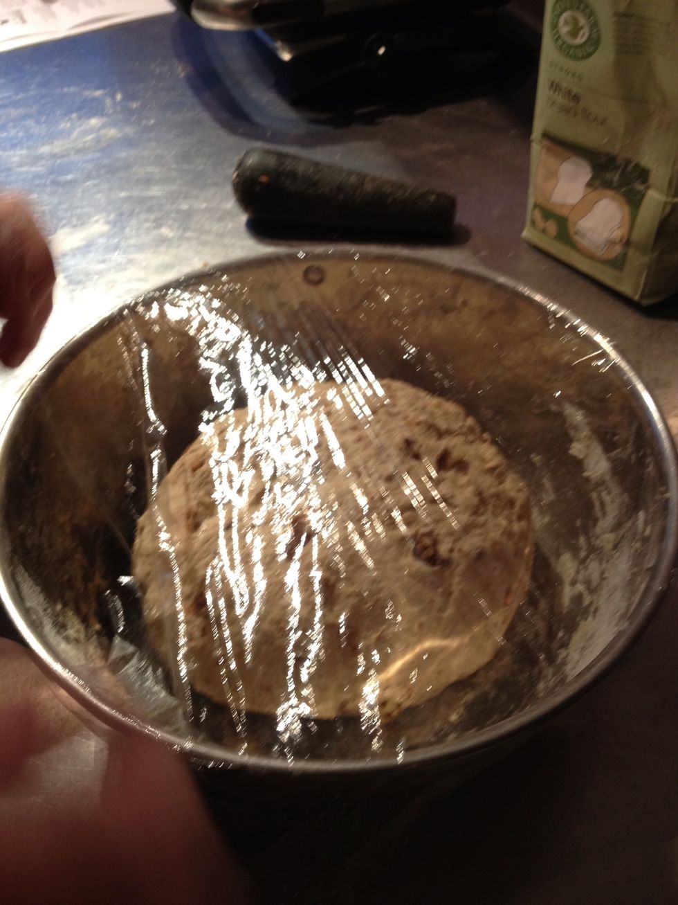 Cover the dough with cling film and let it rise in a warm place for 45min. (Rising the dough in a warmed up tumble dryer which is switched off! has proven to work well).