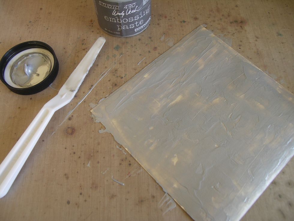 Cover the entire background with silver embossing paste and allow to dry (don't worry about getting a smooth coverage).