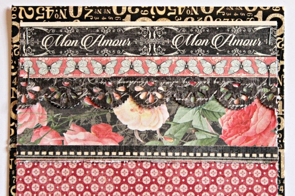 Cover the envelops with pattern paper; adding borders to the top of each envelop.