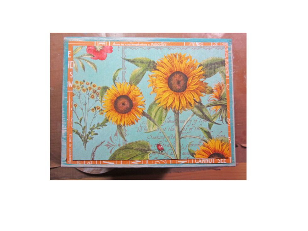 Cover the front of your box with paper before attaching the wheels.  I'm using the beautiful Time to Flourish collection from Graphic 45.  I've layered it on solid pattern paper for more detail.