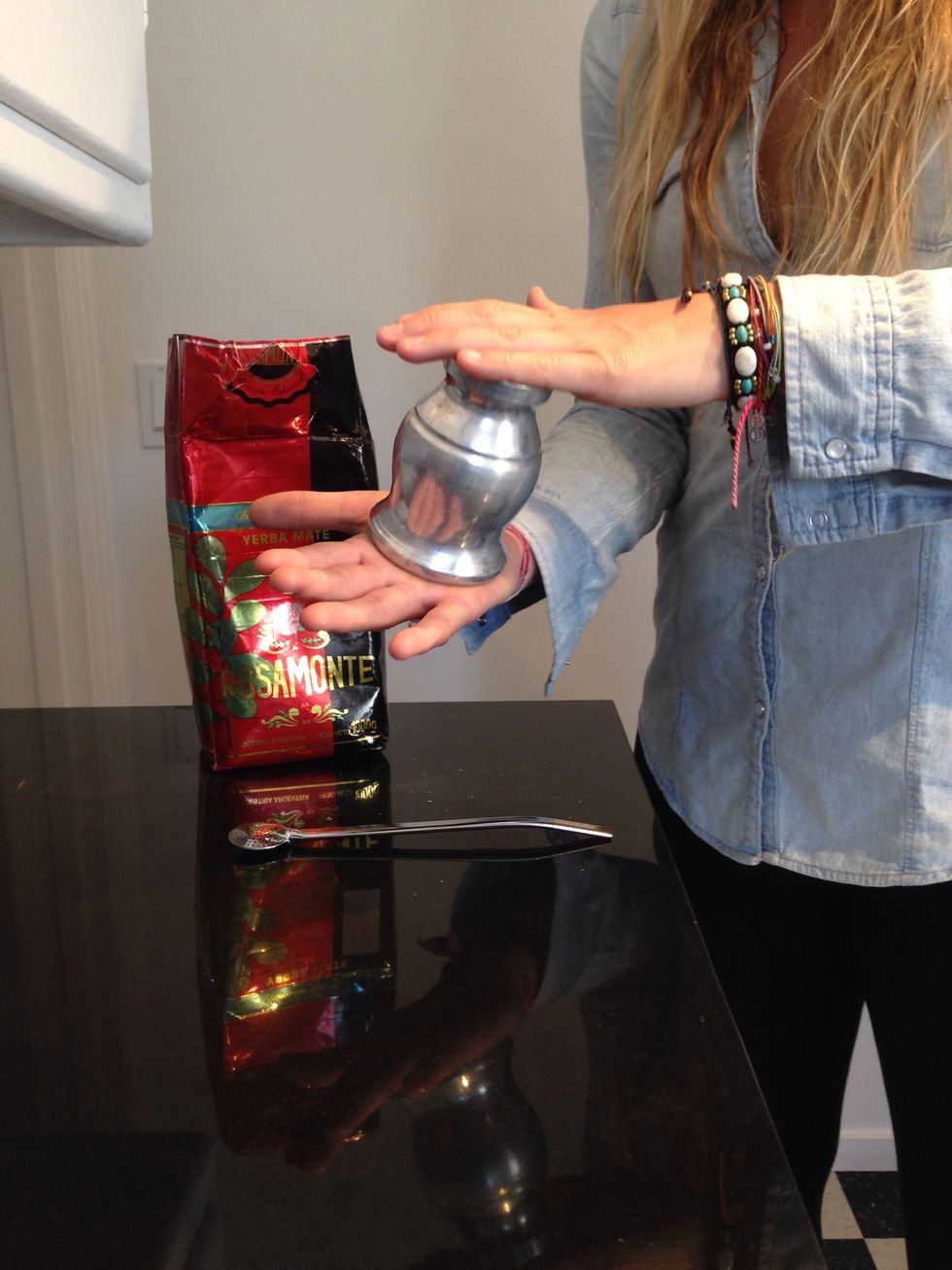 Cover the gourd with your palm & invert