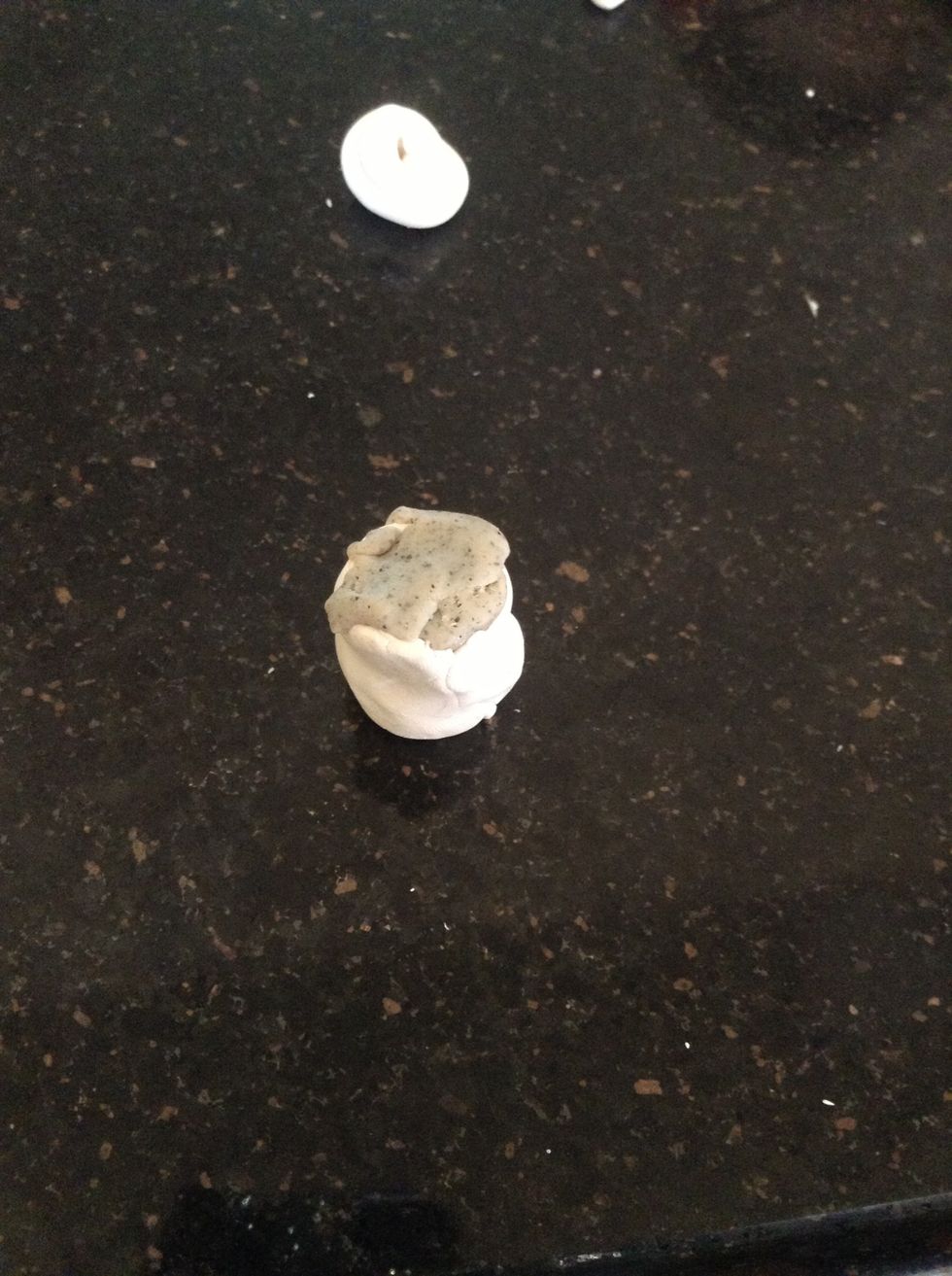 Cover the gray clay with the rolled out white clay.