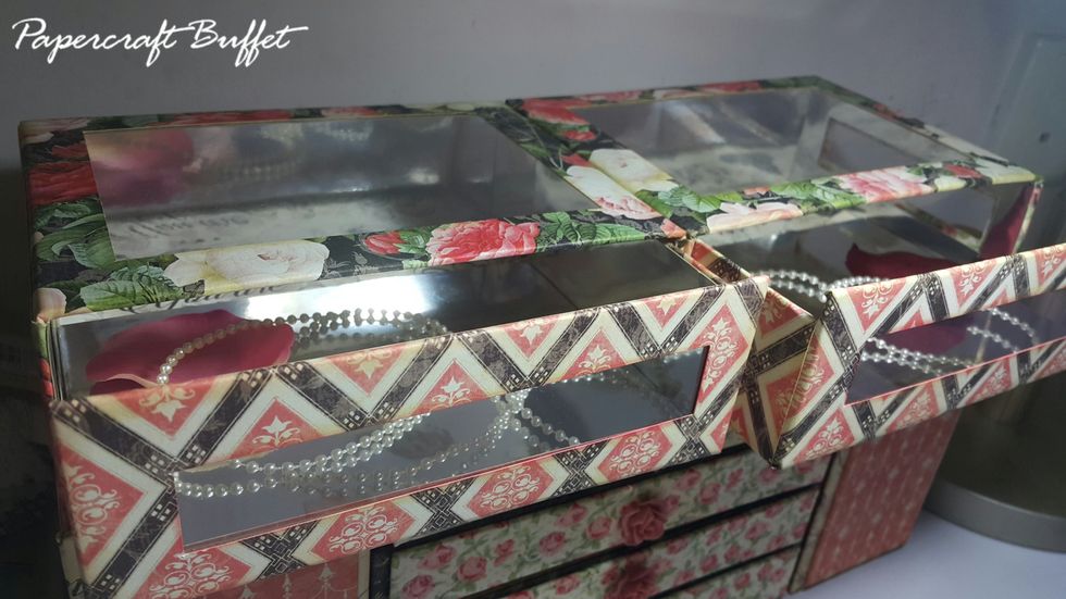 Cover the holes with acetate and then the outside boxes with paper and cardstock as well, then the dresser is almost done.