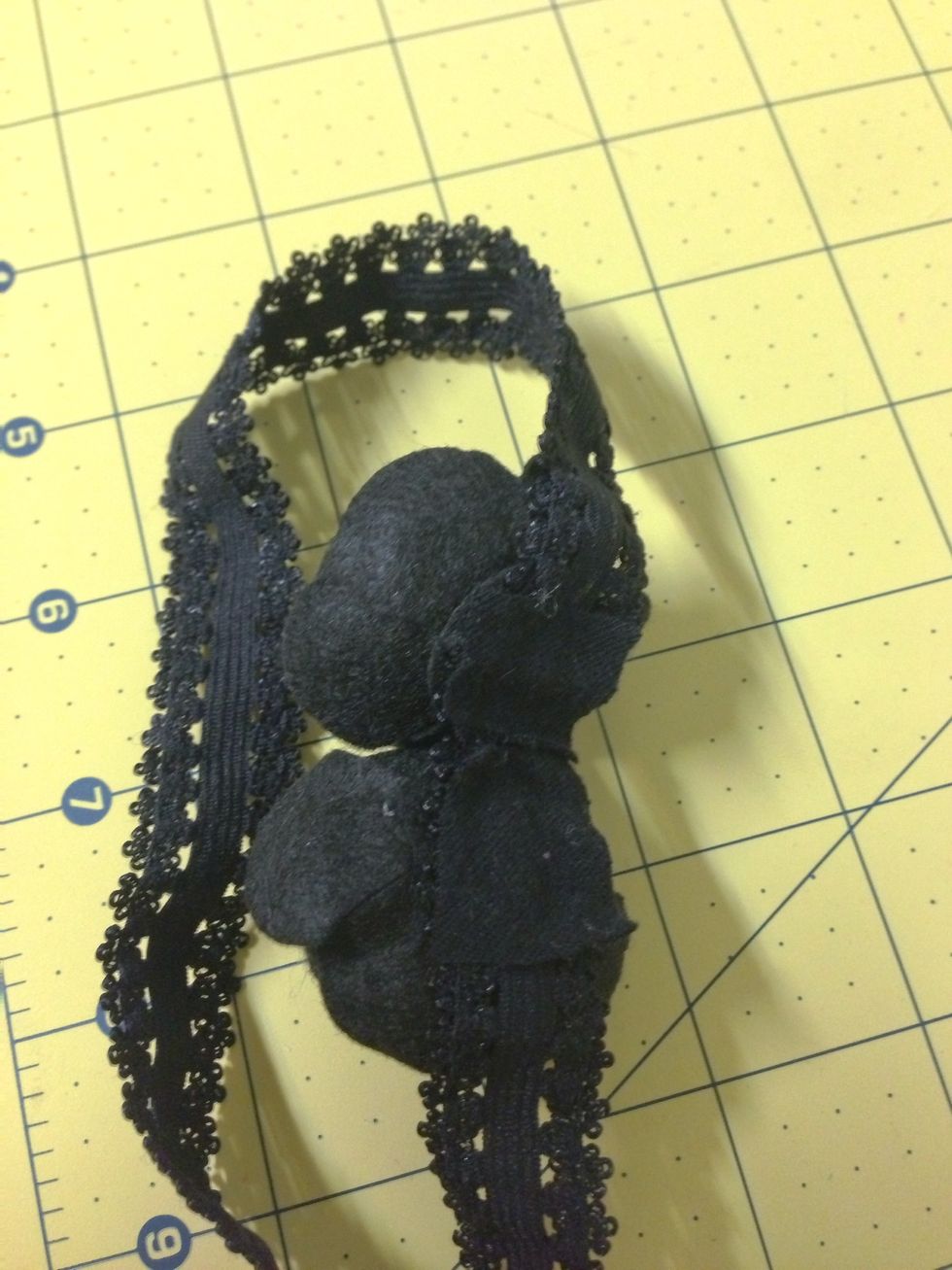 Cover the hot glued portion with a small piece of scrap felt and a small dot of hot glue.