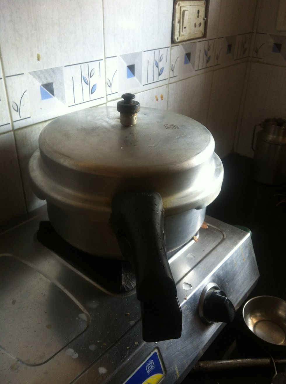 Cover the lid let it pressure cook for sometime...3-4 whistles should do the job of making the mutton tender