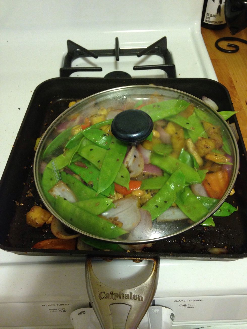 Cover the mixture and let everything simmer on medium heat for 5 minutes.