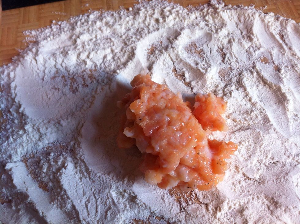 Cover the mixture completely in flour.