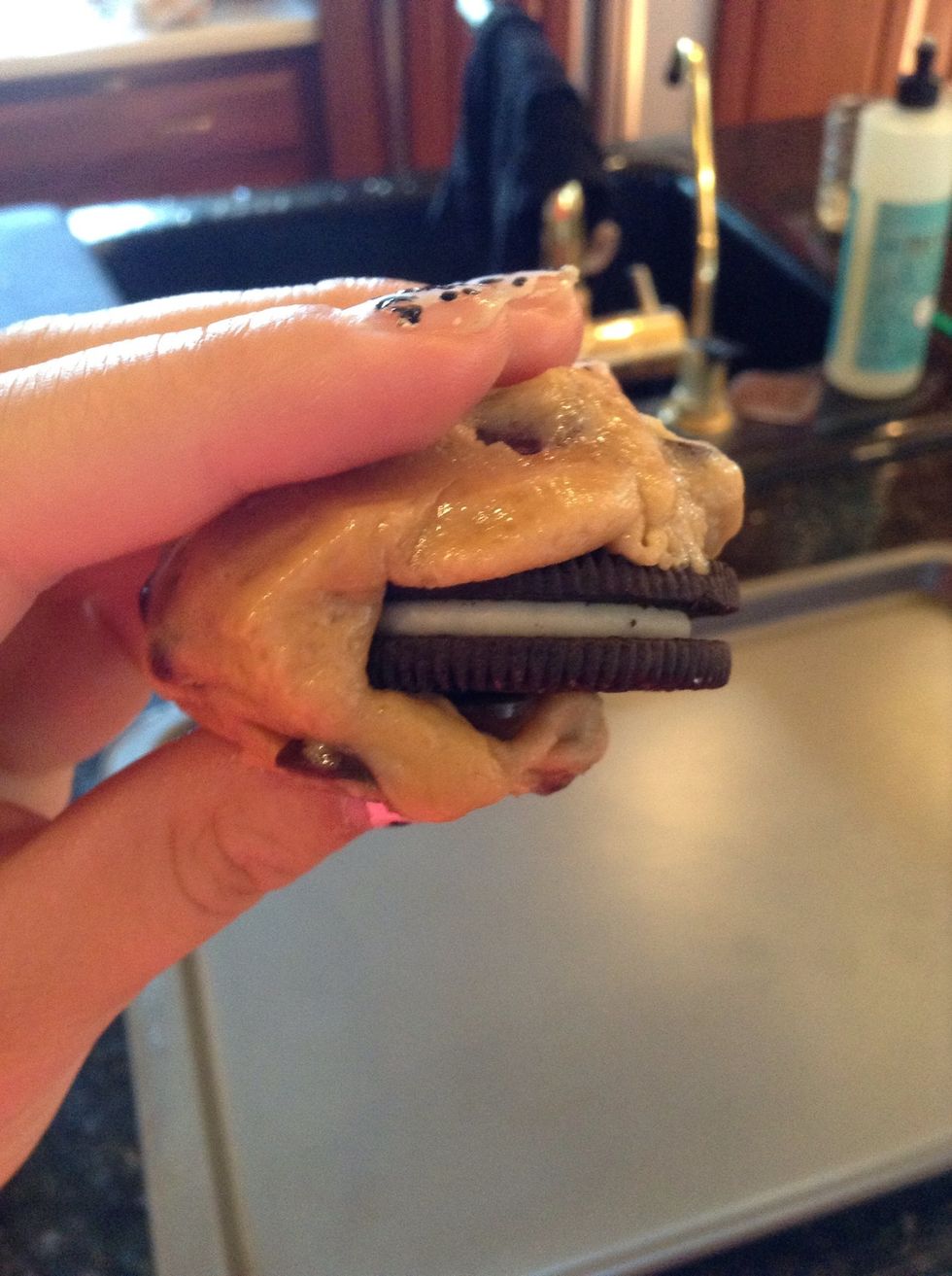 Cover the Oreo with the cookie dough. You may have to add or take away some of the dough depending on how much you want covering the Oreo.