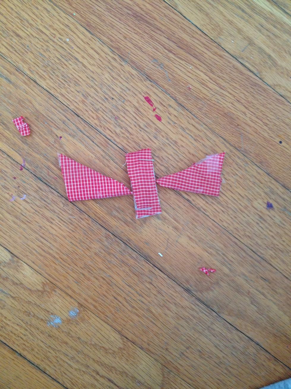 Cover the other pointed edge in red fabric. The three red shapes should look like this.