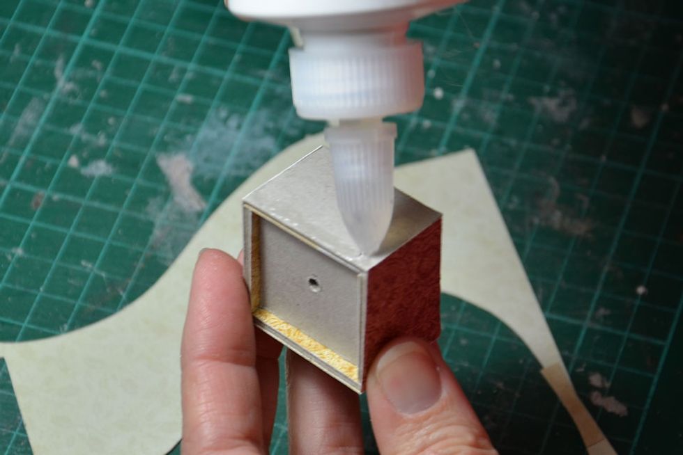 Cover the outside of the basket in your choice of patterned paper.