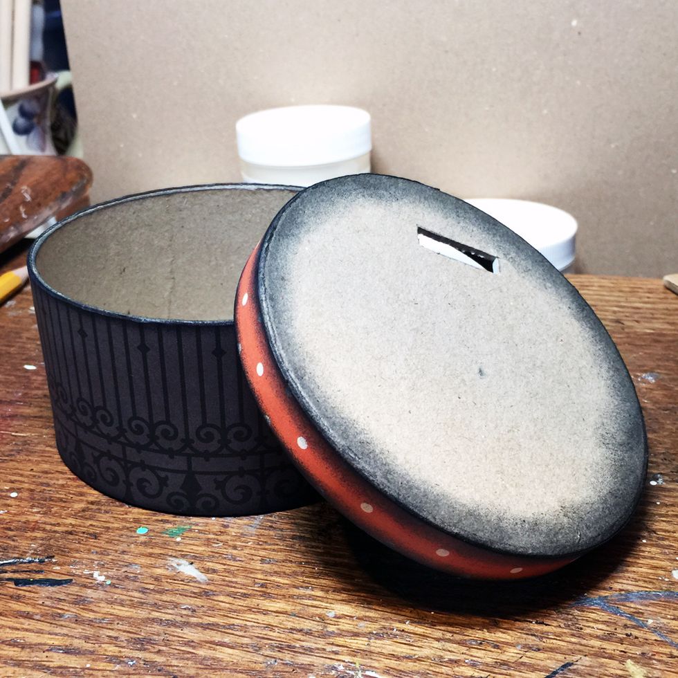 Cover the paper mache box with paper where you want it. Ink the box edges if desired.