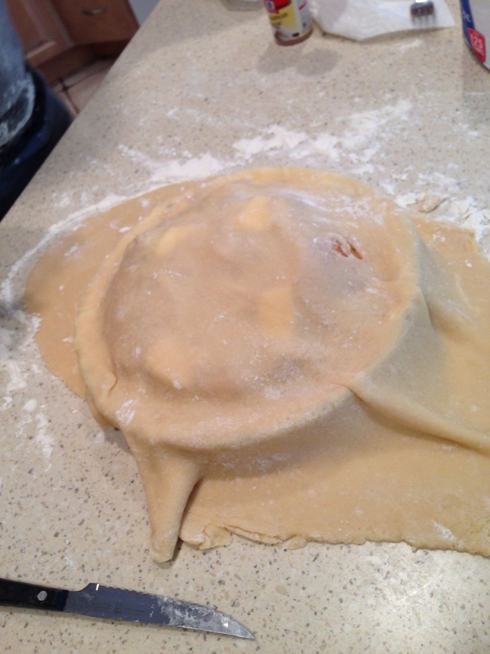 Cover the pie and press the fork around the edges again. Remove excess dough