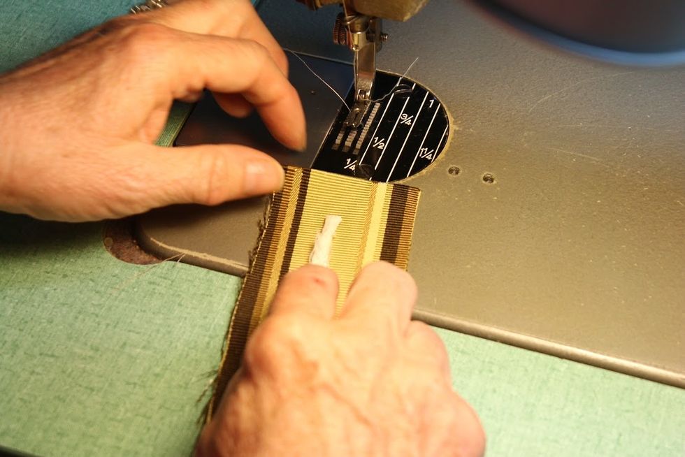 Cover the piping using a velvet zipper foot.  This is sometimes called a center stitch zipper foot.