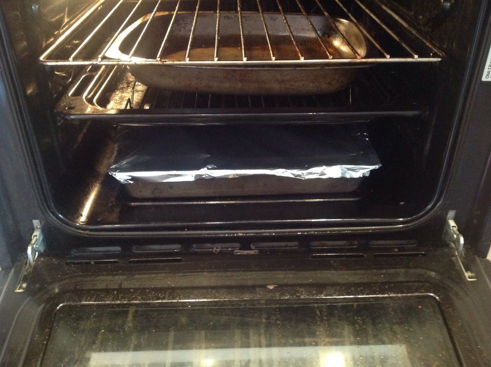 Cover the pork meat with tinfoil and return to the oven on the bottom shelf, this is to stop the pork drying out