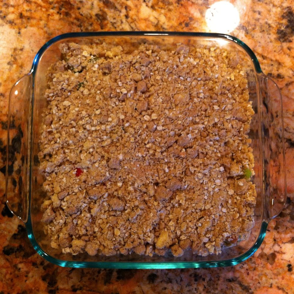 Cover the rhubarb with the brown sugar, flour, oats, and butter mix.