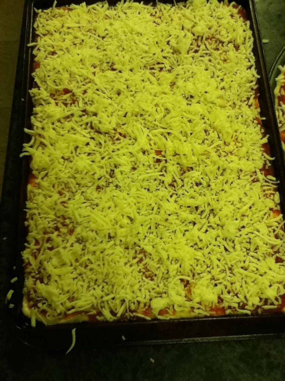 Cover the sauce until there are very few places where it is visible.