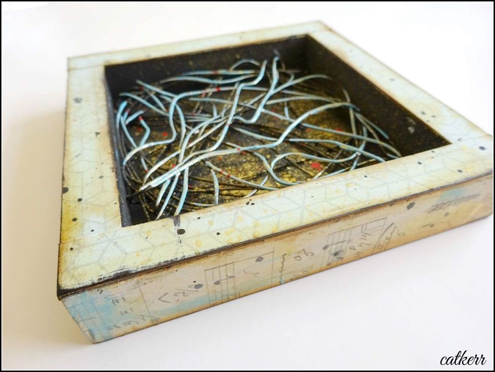 Cover the shadowbox in Cardstock. Ink the edges