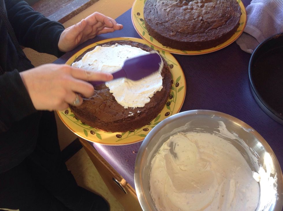 Cover the top of one cake with icing