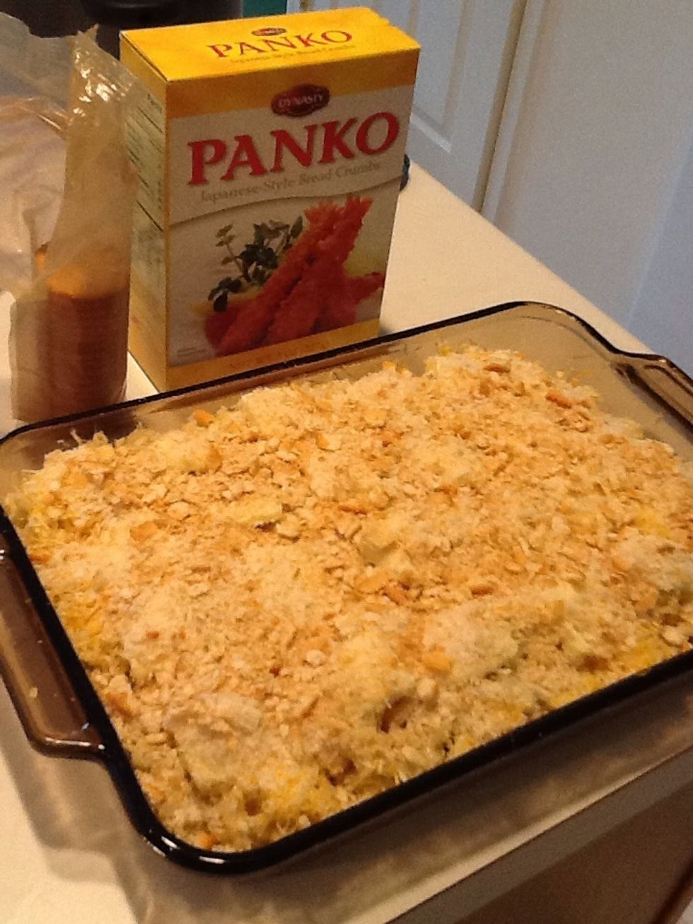Cover the top of your macaroni and cheese with your choice of bread crumbs.  I prefer a combination of Panko, found in the Oriental/Asian food aisle, and crushed Ritz crackers.