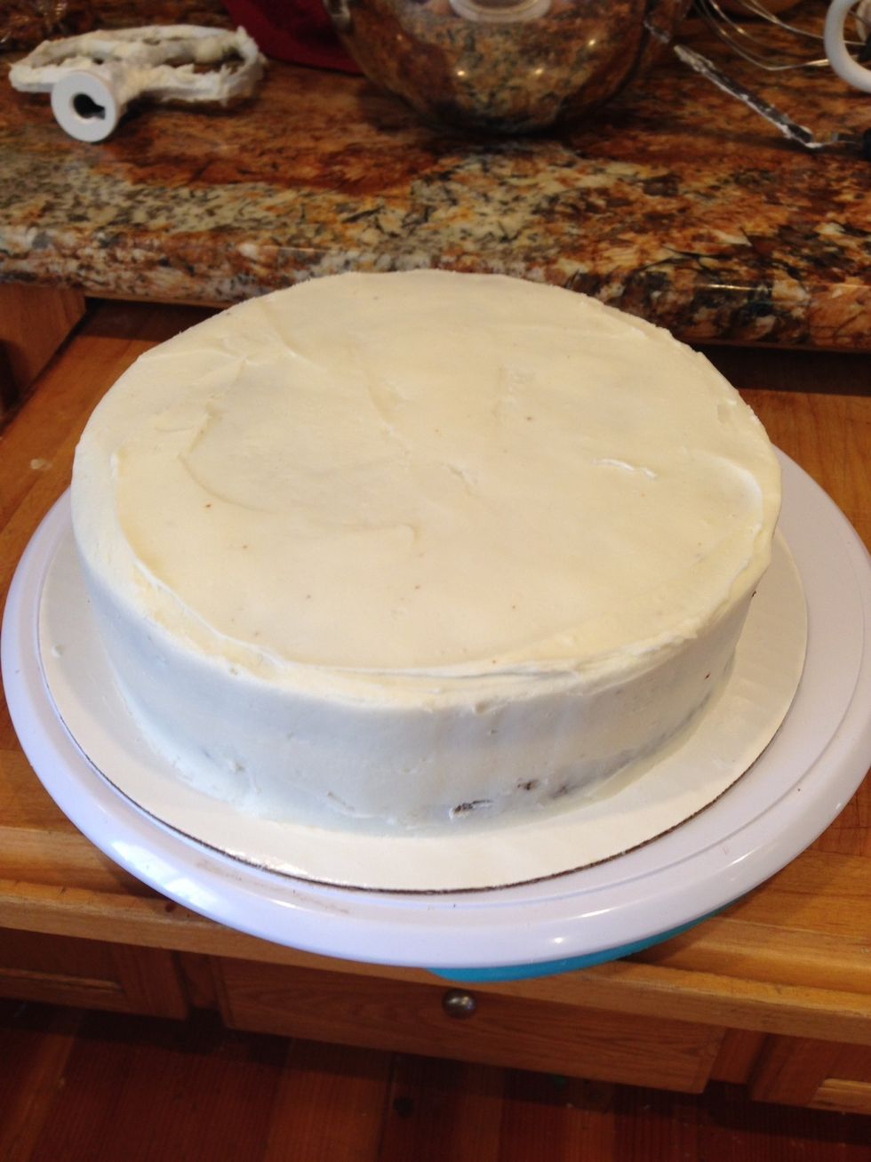 Cover the whole cake with a thin layer of icing, and place in the fridge to crust over.