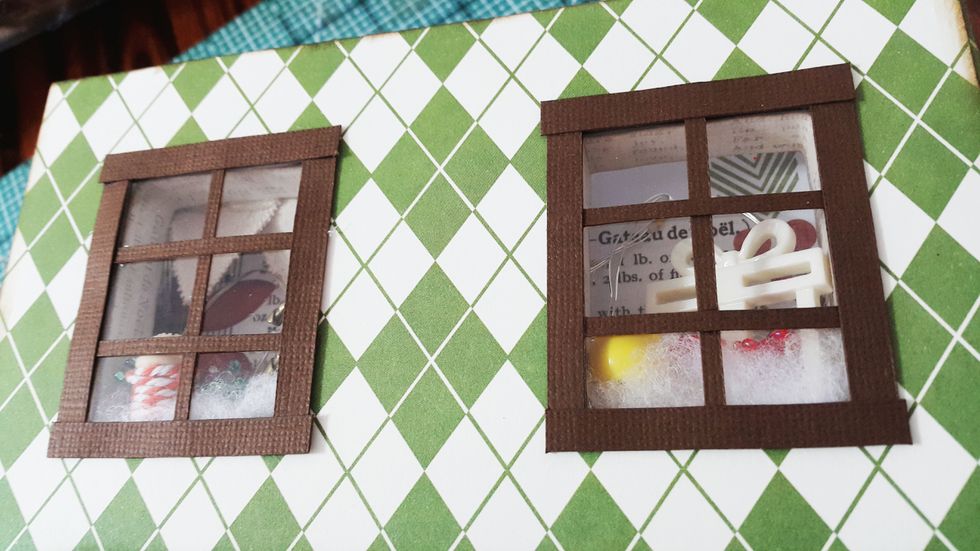 Cover the window with acetate measured 2-1/4"x1-3/4", then add the window frame using brown cardstock of 1/8" and 1/16" respectively.