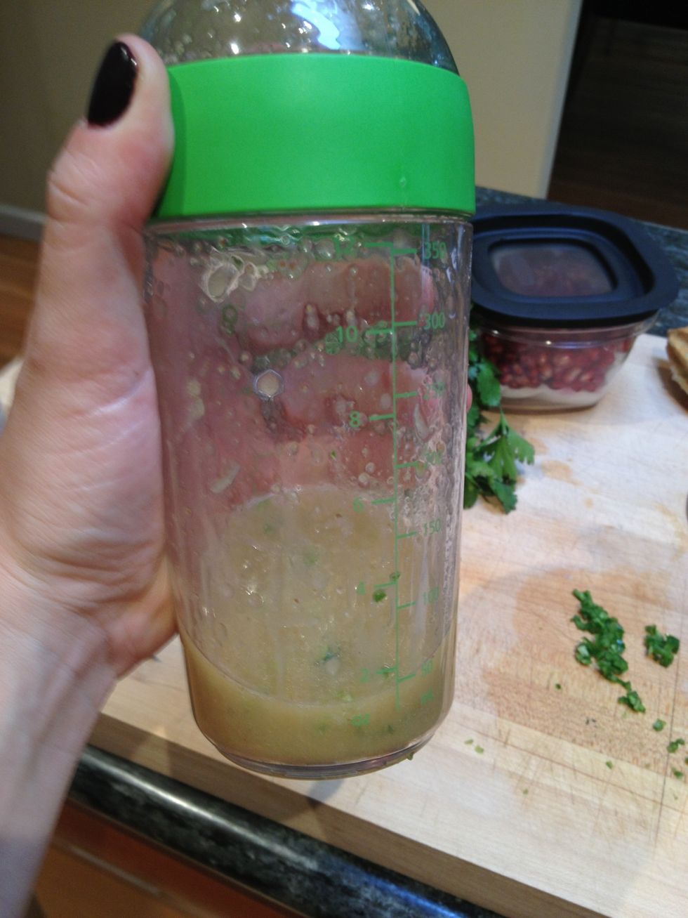 Cover tightly and shake hard to mix very well.